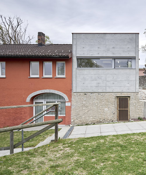 a contemporary addition plugs onto enrico sassi's 'casa rossa' in the swiss alps