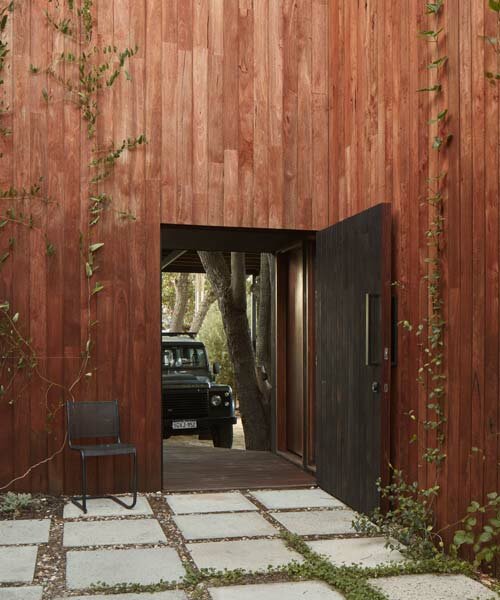 grotto studio extends perth cottage with charred timber 'shadow house'