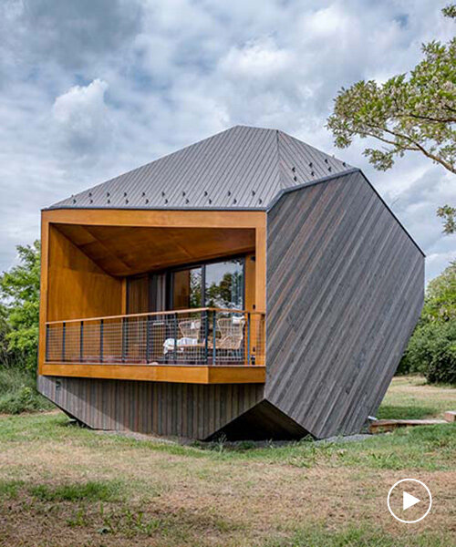 hello wood's resort weaves six boulder-like cabins into rural hungary