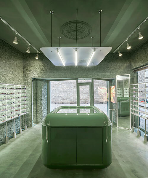 high-tech elements and 'texturized minimalism' shape all-green optical boutique in barcelona