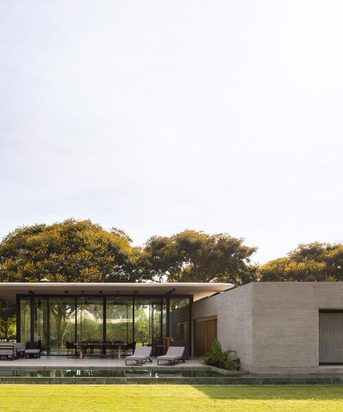 thin reinforced concrete sheet hovers above the glazed living room of house jp in argentina