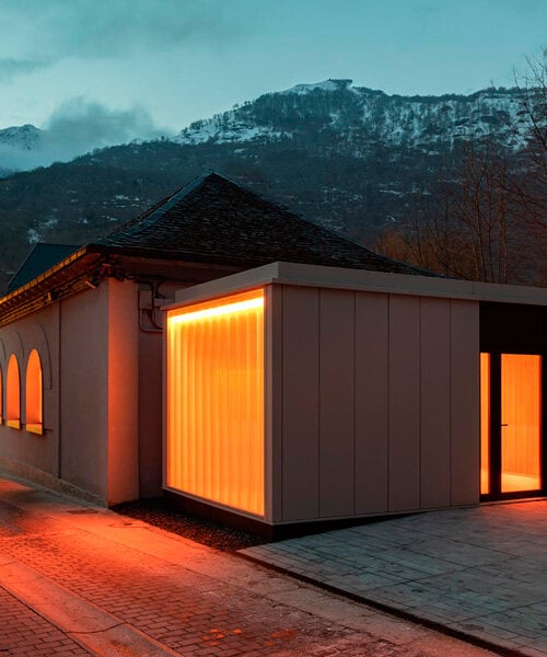 haro museum's translucent openings illuminate the square of val d'aran in spain