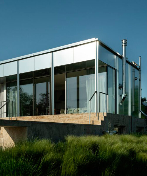 reflective aluminum framework crowns the clifftop house by KONTEXTUS in hungary